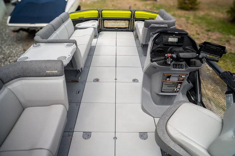 Slide: The Image of Interior of 2024 Sea-Doo Switch Cruise with gray seating and helm console. - 7