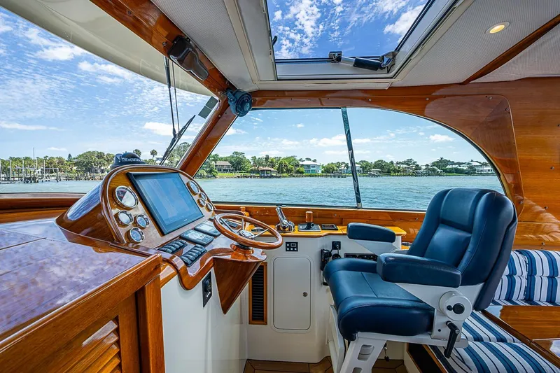 Slide: The Image of Luxurious helm of 2013 Hinckley Picnic Boat 37 MKIII with scenic water view. - 12