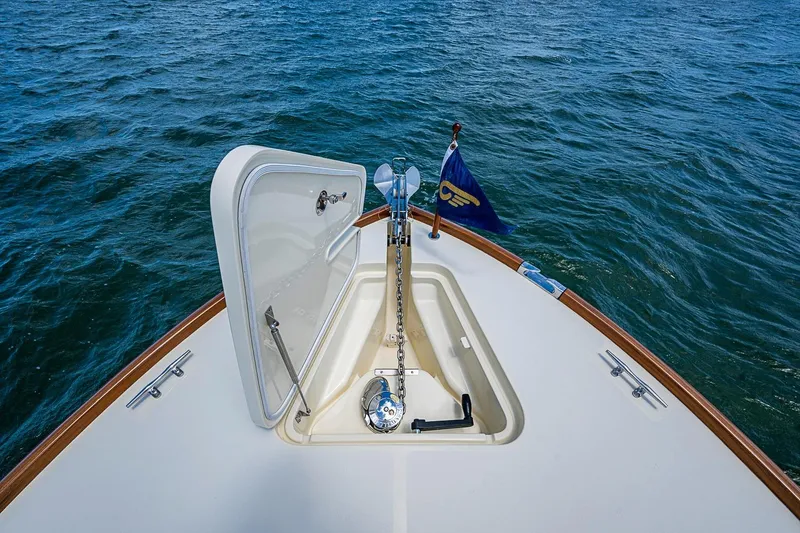 Slide: The Image of Hinckley Picnic Boat 37 MKIII 2013 anchor compartment with open hatch on calm water. - 21