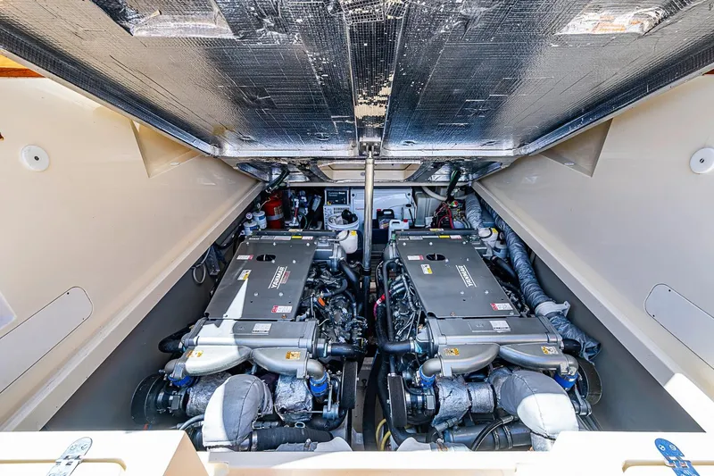 Slide: The Image of Engine compartment of 2013 Hinckley Picnic Boat 37 MKIII, showcasing dual engines. - 23