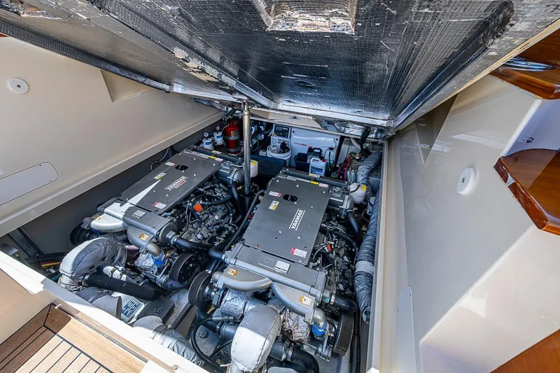 Slide: The Image of Engine compartment of 2013 Hinckley Picnic Boat 37 MKIII, showcasing twin Yanmar engines. - 24