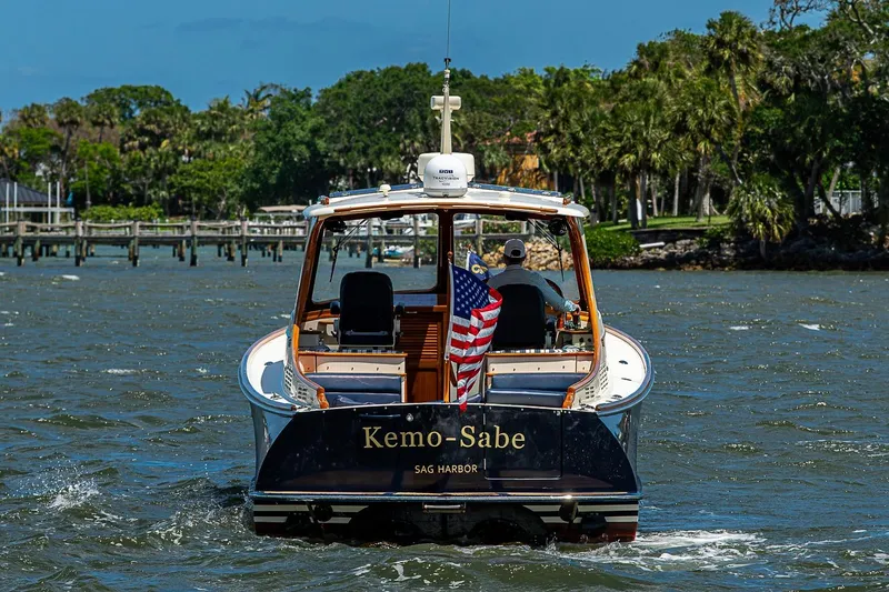 Slide: The Image of 2013 Hinckley Picnic Boat 37 MKIII cruising on a sunny day with American flag. - 3