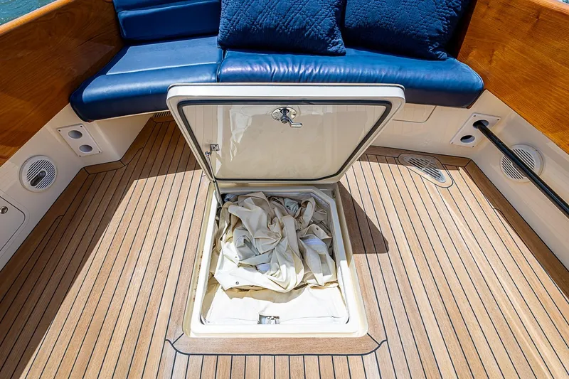 Slide: The Image of Hinckley Picnic Boat 37 MKIII 2013 with open storage hatch on teak deck. - 5