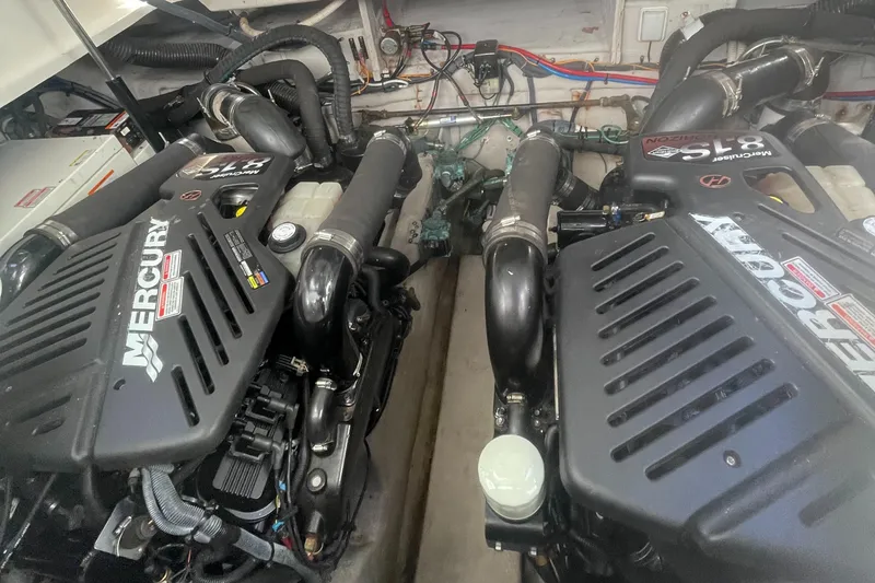 Slide: The Image of Twin Mercury engines in a 2006 Sea Ray 380 Sundancer boat engine compartment. - 25