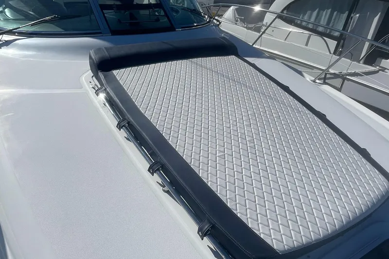 Slide: The Image of 2006 Sea Ray 380 Sundancer yacht with sunpad on deck, featuring sleek design and luxury amenities. - 31