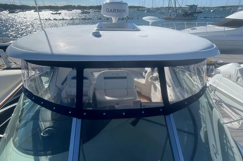 Slide: The Image of 2006 Sea Ray 380 Sundancer yacht with Garmin radar, docked in a sunny marina. - 32