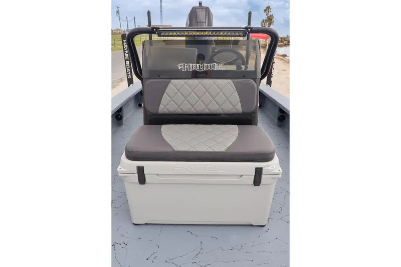 Slide: The Image of 2025 Haynie 24 High Output boat with cushioned seating and Engel cooler. - 14
