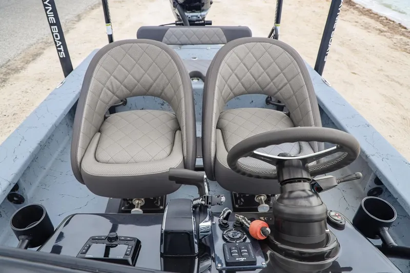 Slide: The Image of Interior of 2025 Haynie 24 High Output boat with dual seats and steering console. - 15