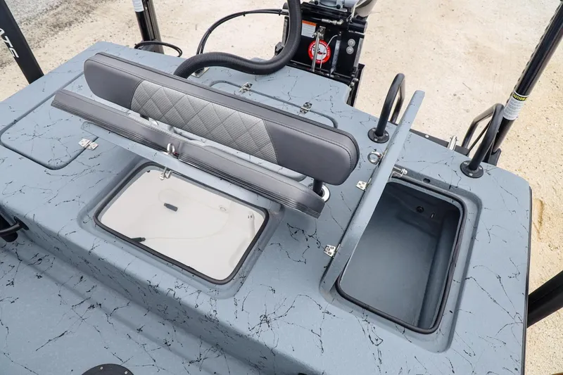 Slide: The Image of 2025 Haynie 24 High Output boat with open storage compartments and seating. - 34