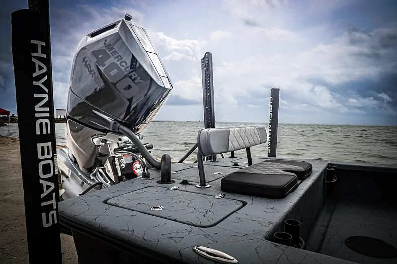 Slide: The Image of 2025 Haynie 24 High Output boat with Mercury 400 engine by the sea. - 37