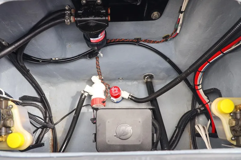 Slide: The Image of Engine compartment of 2025 Haynie 24 High Output boat, showcasing wiring and components. - 39