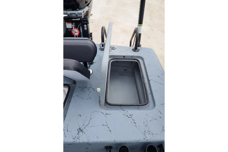 Slide: The Image of 2025 Haynie 24 High Output boat interior with storage compartment and seating. - 42