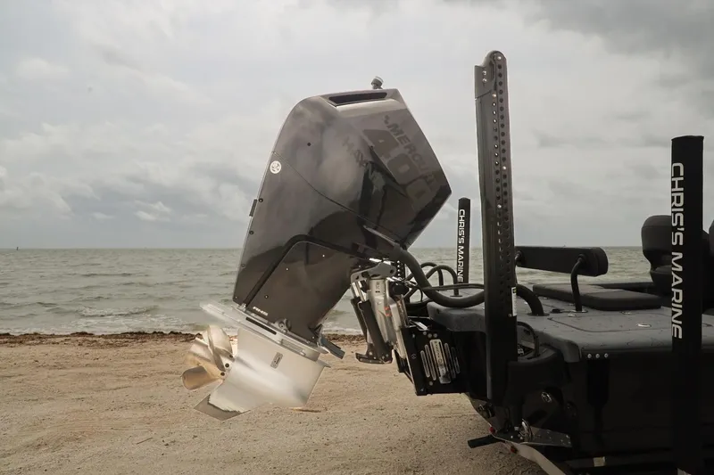 Slide: The Image of 2025 Haynie 24 High Output boat with powerful outboard motor on a sandy beach. - 43