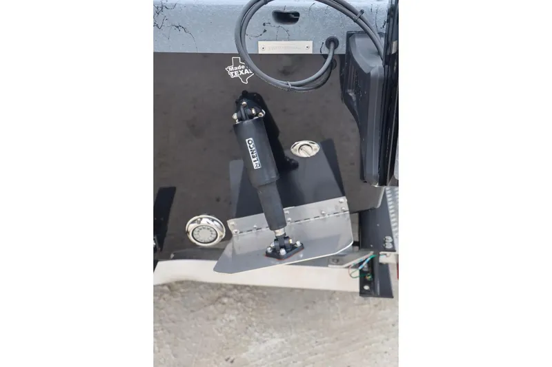 Slide: The Image of 2025 Haynie 24 High Output boat with trim tab and hydraulic actuator. - 45