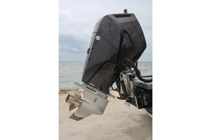 Slide: The Image of Outboard motor of 2025 Haynie 24 High Output boat by the sea. - 46