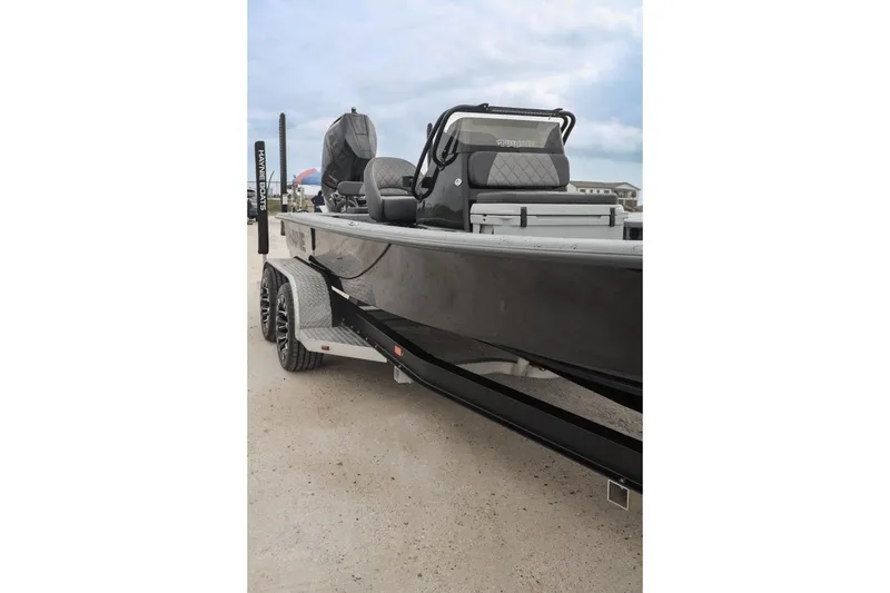 Slide: The Image of 2025 Haynie 24 High Output boat on trailer, showcasing sleek design and modern features. - 6