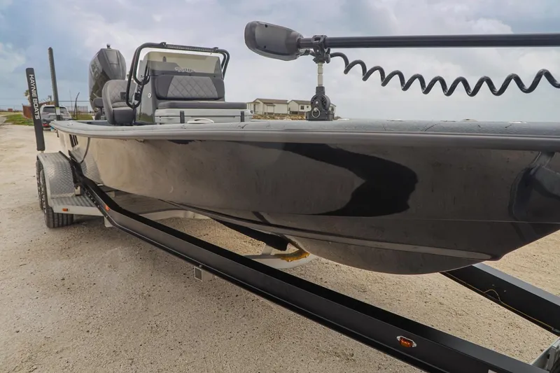 Slide: The Image of 2025 Haynie 24 High Output boat on trailer, showcasing sleek design and modern features. - 8