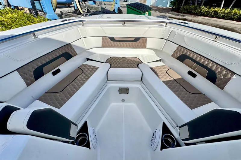 Slide: The Image of Luxurious seating area on a 2023 Blackfin 272 DC boat, featuring elegant upholstery. - 28