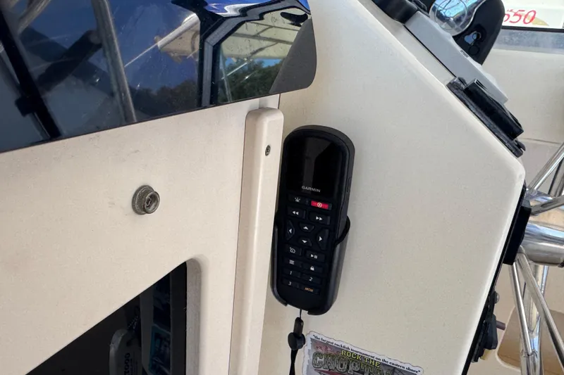 Slide: The Image of Garmin marine radio mounted on a 2002 Parker 2510 Walkaround boat console. - 11