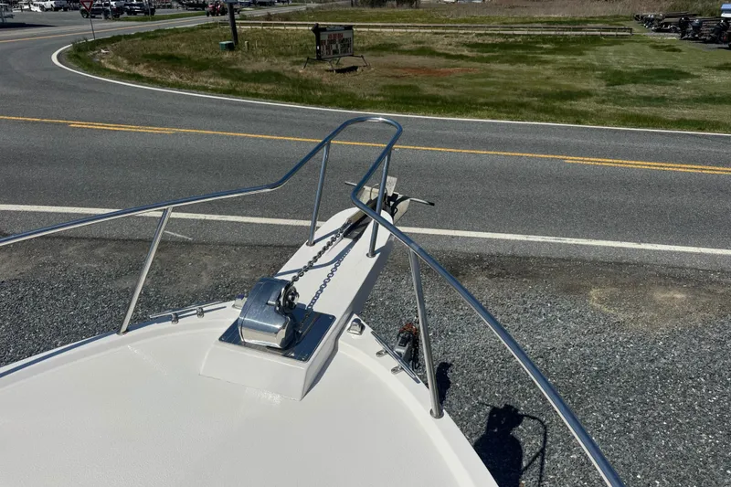 Slide: The Image of Bow view of 2002 Parker 2510 Walkaround boat with anchor and railing. - 18