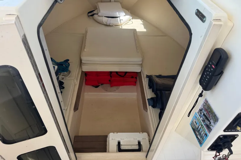 Slide: The Image of Interior cabin of a 2002 Parker 2510 Walkaround boat with safety equipment. - 9