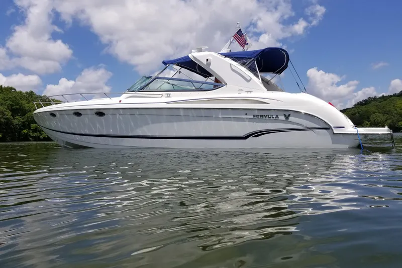 The Image of 2007 Formula 400 Super Sport boat on calm water under a blue sky. - 1