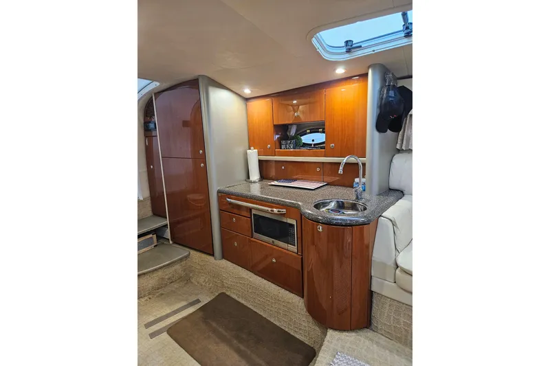 Slide: The Image of Interior of 2007 Formula 400 Super Sport yacht with kitchenette and wood cabinetry. - 10