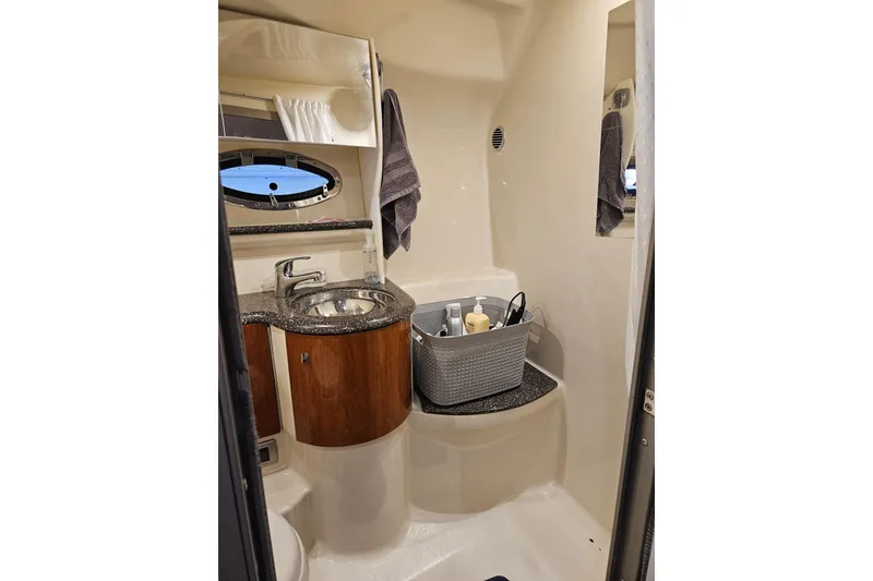 Slide: The Image of 2007 Formula 400 Super Sport yacht bathroom with sink, mirror, and toiletries. - 14