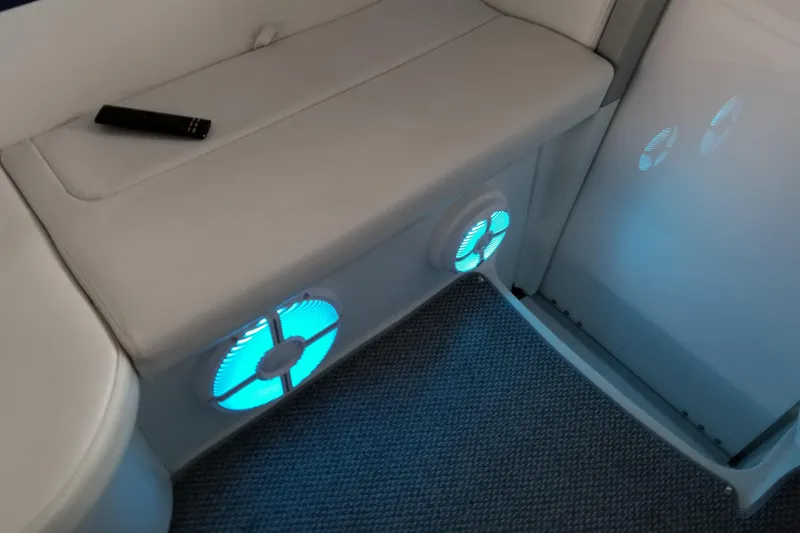 Slide: The Image of Interior of 2007 Formula 400 Super Sport with blue-lit speakers and remote control. - 21