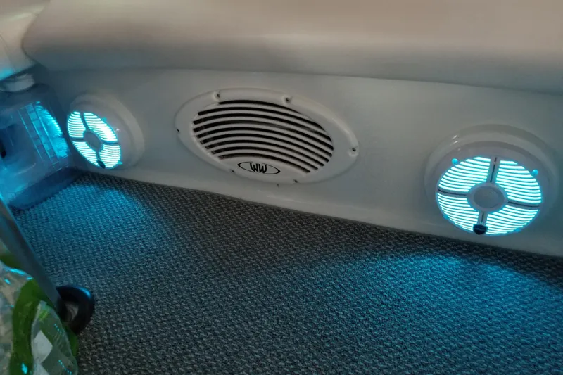 Slide: The Image of Illuminated speakers on a 2007 Formula 400 Super Sport boat interior. - 22