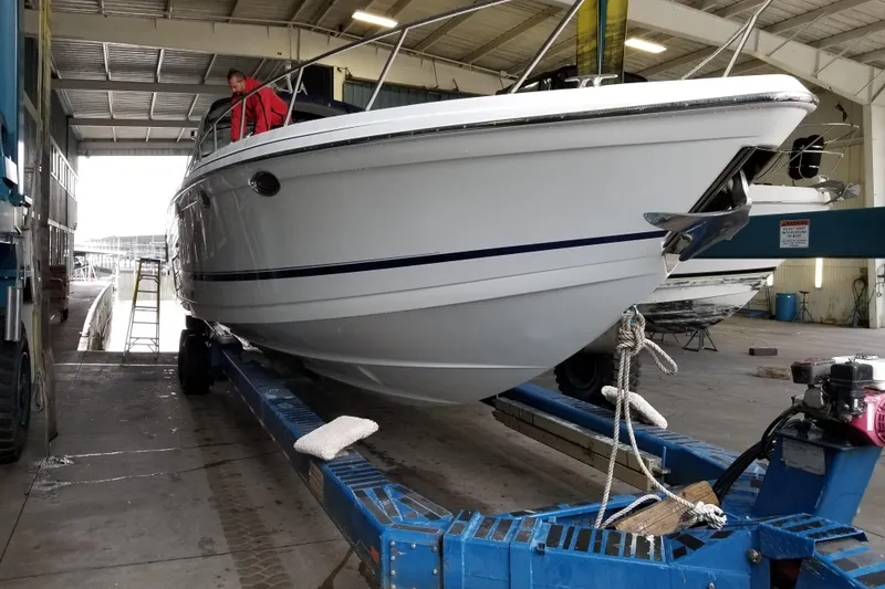 Slide: The Image of 2007 Formula 400 Super Sport boat on trailer in a marina workshop. - 23