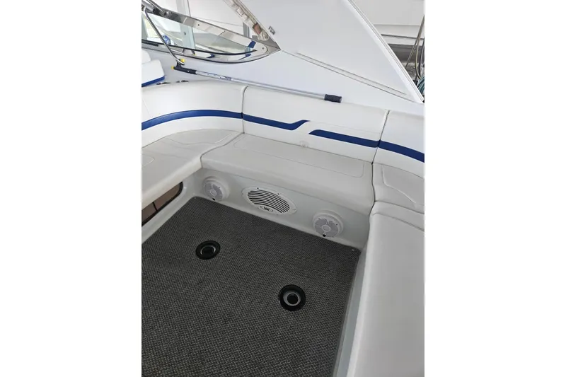 Slide: The Image of 2007 Formula 400 Super Sport boat interior with white seating and blue accents. - 3