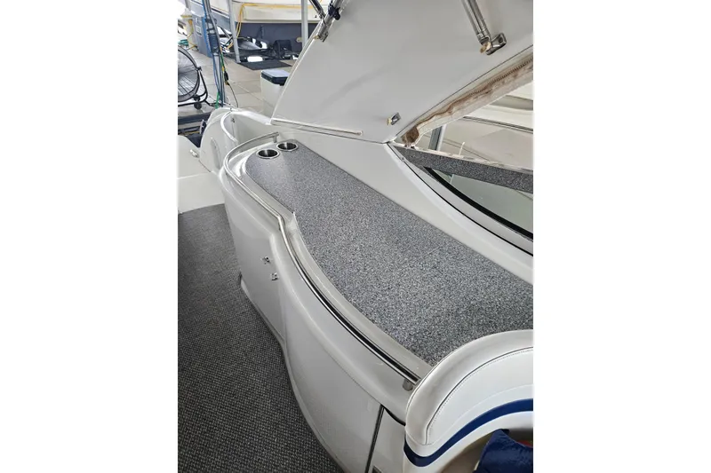 Slide: The Image of 2007 Formula 400 Super Sport boat interior with sleek countertop and cup holders. - 4