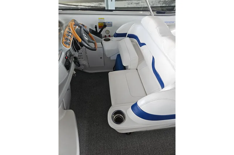 Slide: The Image of Interior of a 2007 Formula 400 Super Sport boat with white and blue seating. - 8