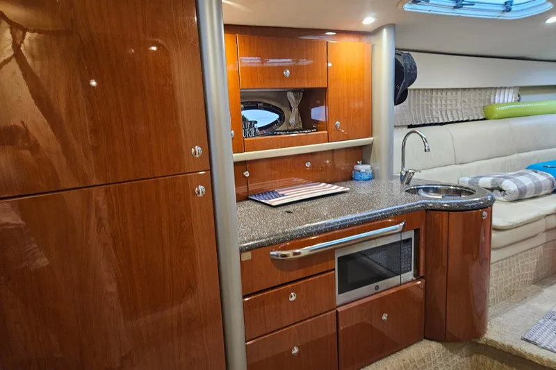 Slide: The Image of Luxurious interior of a 2007 Formula 400 Super Sport yacht with modern kitchenette. - 9