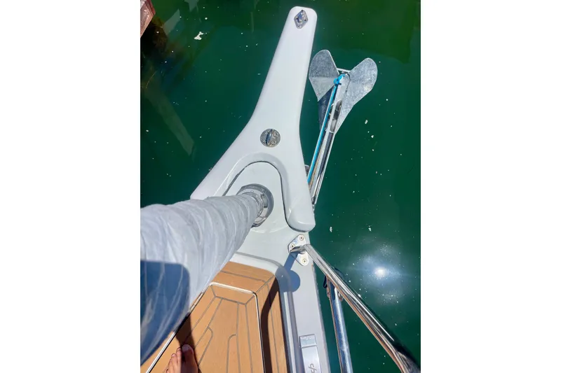 Slide: The Image of Bow of 2014 Grand Soleil 43F yacht with anchor over clear water. - 12