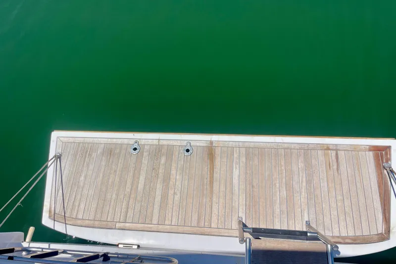 Slide: The Image of Grand Soleil 43F 2014 yacht's wooden deck above green water. - 14