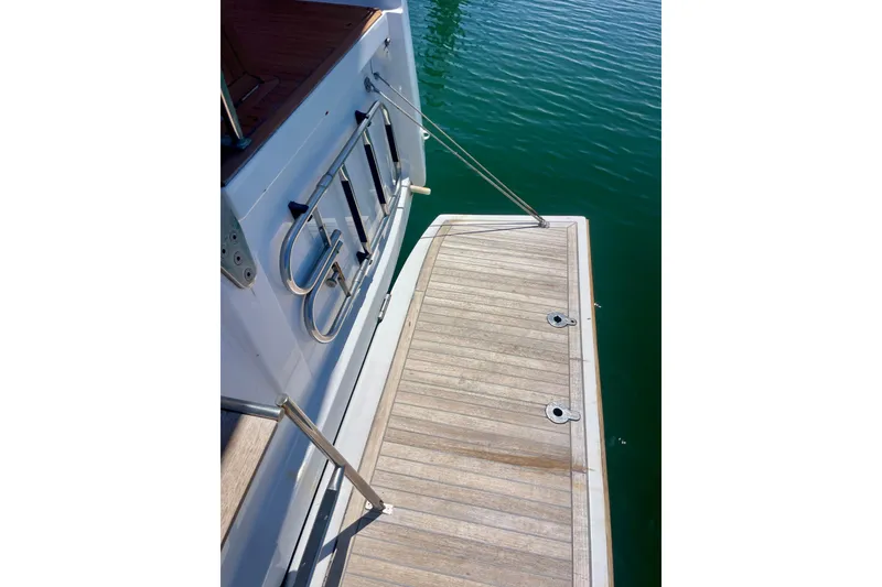 Slide: The Image of Sailing yacht Grand Soleil 43F 2014, featuring a wooden swim platform and stainless steel ladder. - 16