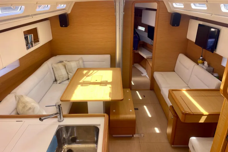 Slide: The Image of Luxurious interior of 2014 Grand Soleil 43F yacht with modern wood finish and white seating. - 18