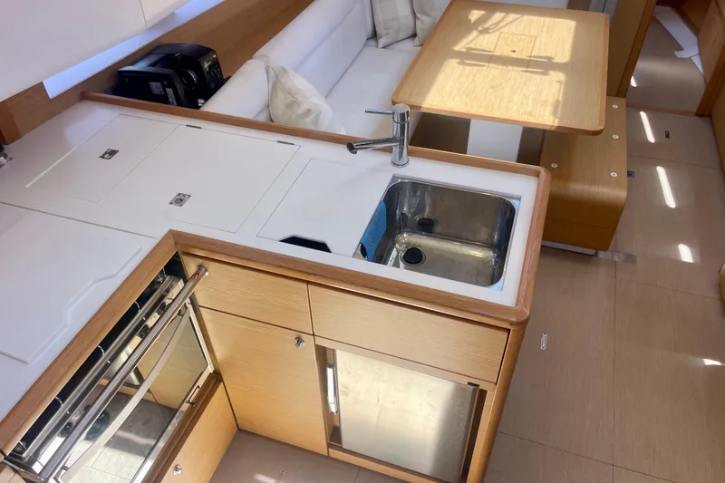 Slide: The Image of Modern kitchen interior of 2014 Grand Soleil 43F yacht with sink and wooden cabinetry. - 19