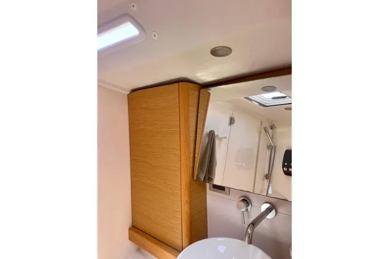 Slide: The Image of Luxurious bathroom interior of 2014 Grand Soleil 43F yacht with wooden cabinetry. - 21