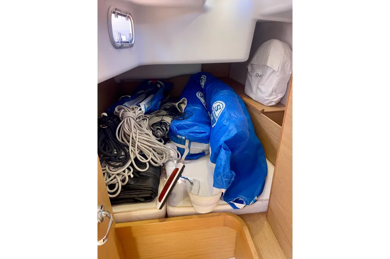Slide: The Image of Storage area in 2014 Grand Soleil 43F yacht with ropes and blue sail. - 25