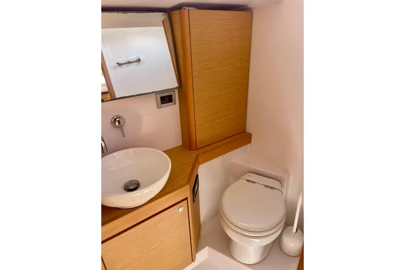Slide: The Image of Modern bathroom in 2014 Grand Soleil 43F yacht with sink and toilet. - 26