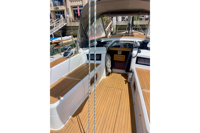 Slide: The Image of 2014 Grand Soleil 43F yacht cockpit with teak decking and marina view. - 32