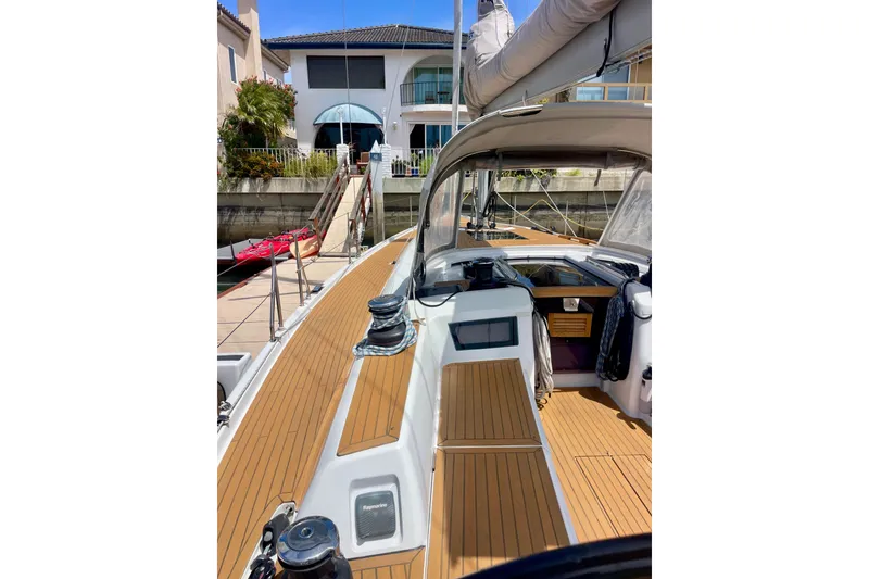 Slide: The Image of 2014 Grand Soleil 43F yacht docked, showcasing sleek deck and modern design. - 33