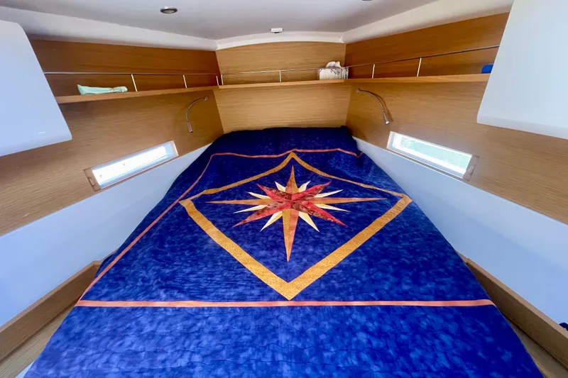 Slide: The Image of Luxurious cabin interior of 2014 Grand Soleil 43F yacht with star-patterned bedding. - 4