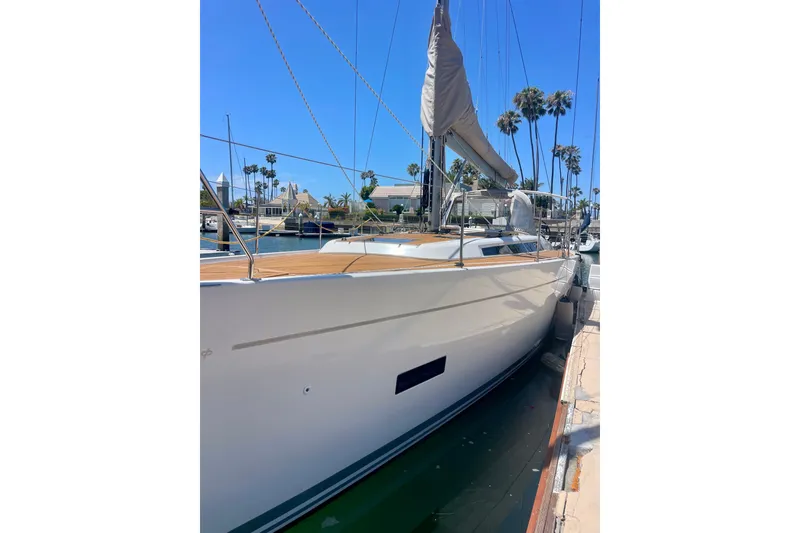 Slide: The Image of 2014 Grand Soleil 43F yacht docked, showcasing sleek design and elegant lines. - 6