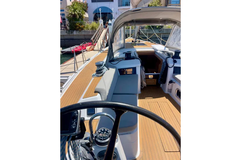 Slide: The Image of 2014 Grand Soleil 43F yacht cockpit with teak deck and modern steering wheel. - 7