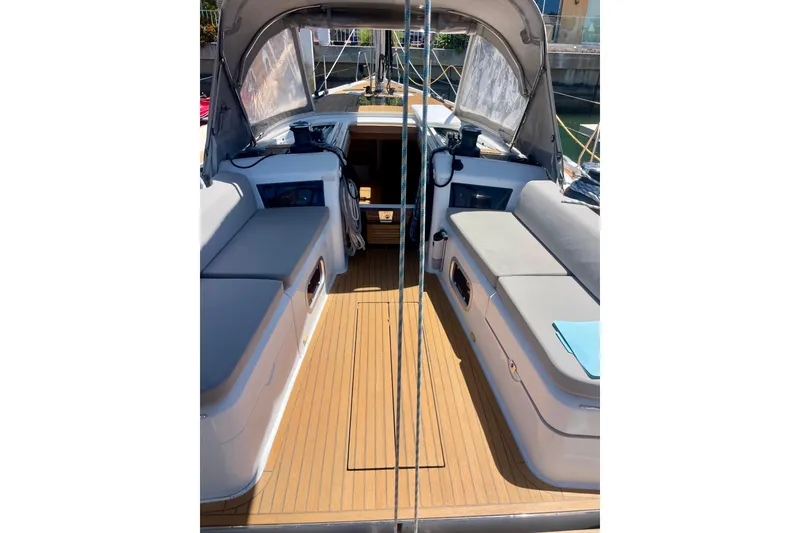 Slide: The Image of Cockpit of 2014 Grand Soleil 43F yacht with cushioned seating and wooden flooring. - 8