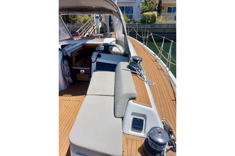 Slide: The Image of 2014 Grand Soleil 43F yacht deck with seating and winch, docked in a marina. - 9